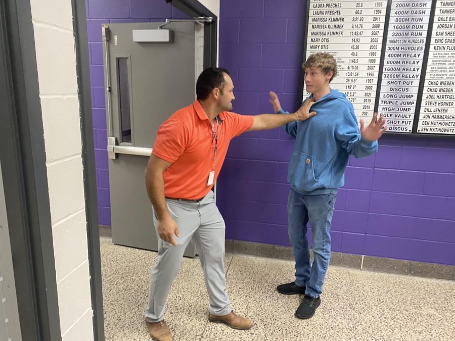 Briggs about to beat punk student.