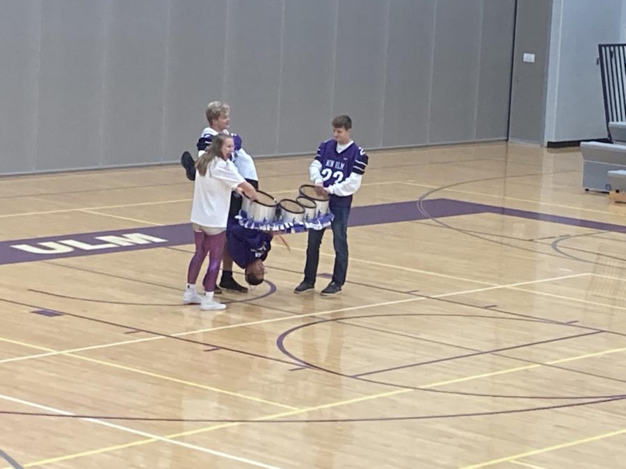 Joey Kotton, a junior in band, plays his drums upside down for his solo at the pep-fest on Friday Sept  23.