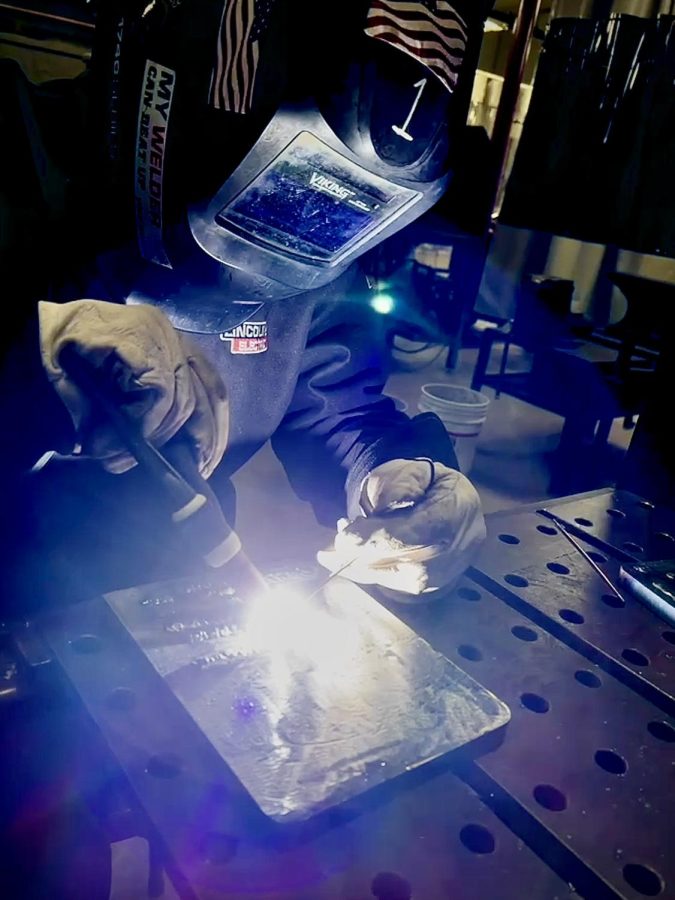 NUHS senior Austin Enter practices TIG welding so he can pursue a job offer he has received from SpecSys Inc.