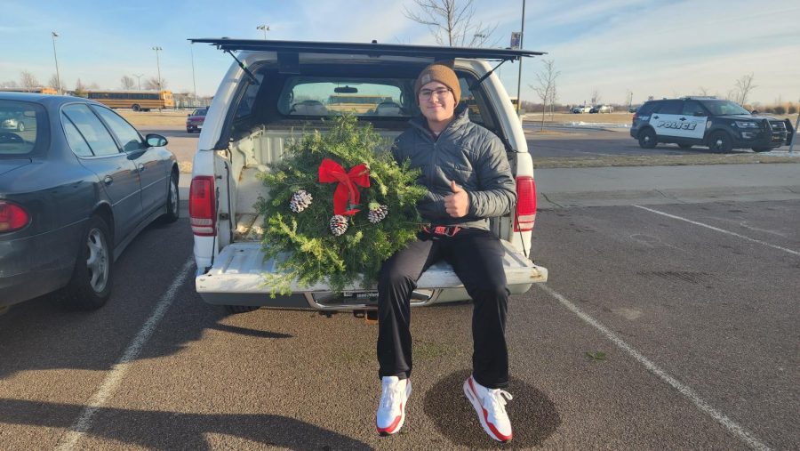 Joey sells Christmas wreaths in the NUHS parking lot for the Boy Scouts fundraiser.