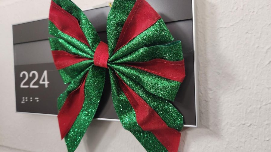 Mr. Engeldinger still has a holiday bow taped to his room number for the holidays. 