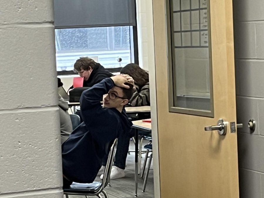 Dylan Portner during 3rd hour posing for the camera. Dylan was working hard on some homework. Dylan says, "Shoot! I needed a break anyways." Dylan is a hard working person when it comes to school work.