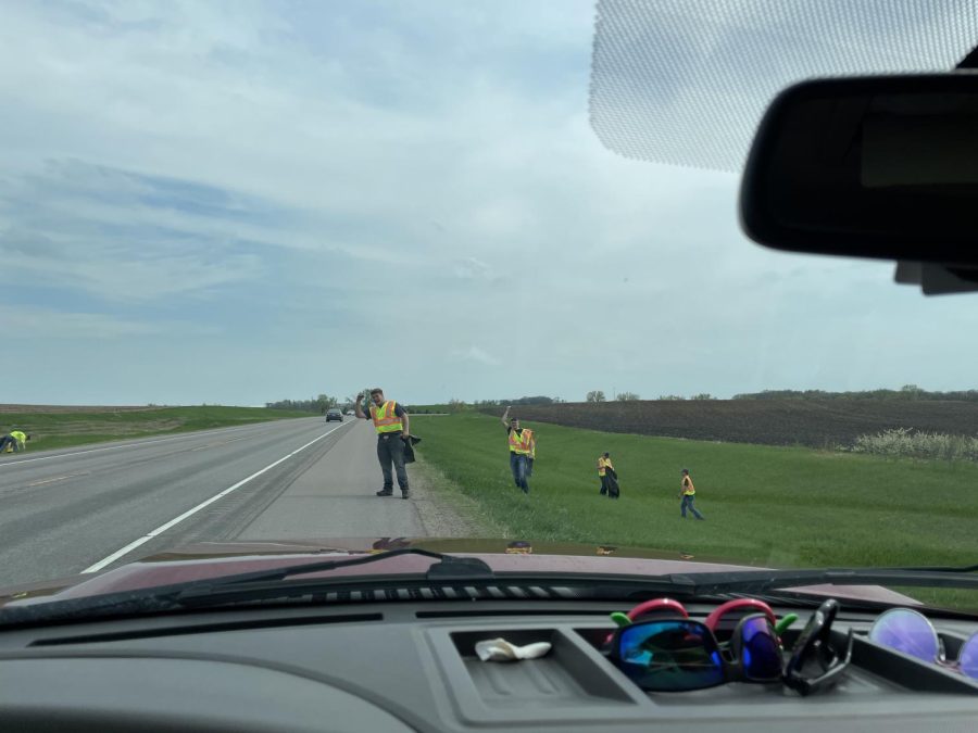 Ethan Dake and other FFA members try to get semi-drivers' attention to make them honk. There is a friendly competition to see which group can get the most semis to honk.