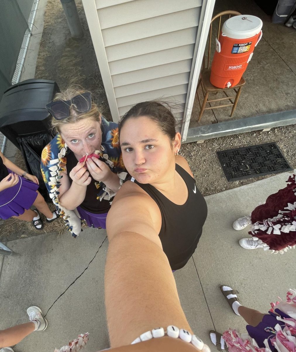 Junior Jocelyn Pettersen takes .5 with senior Sophie Cooke on senior night