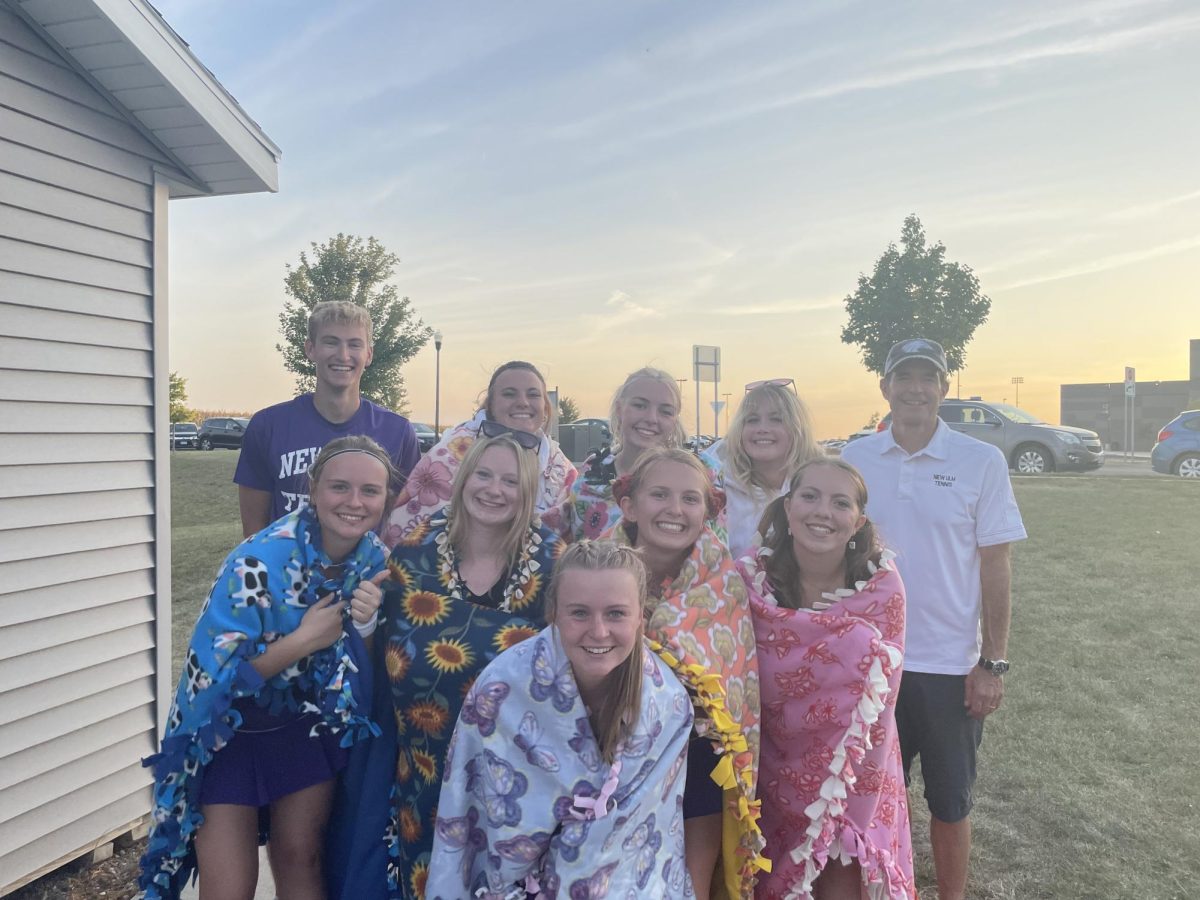 Senior girls with their senior blankets and the coaches