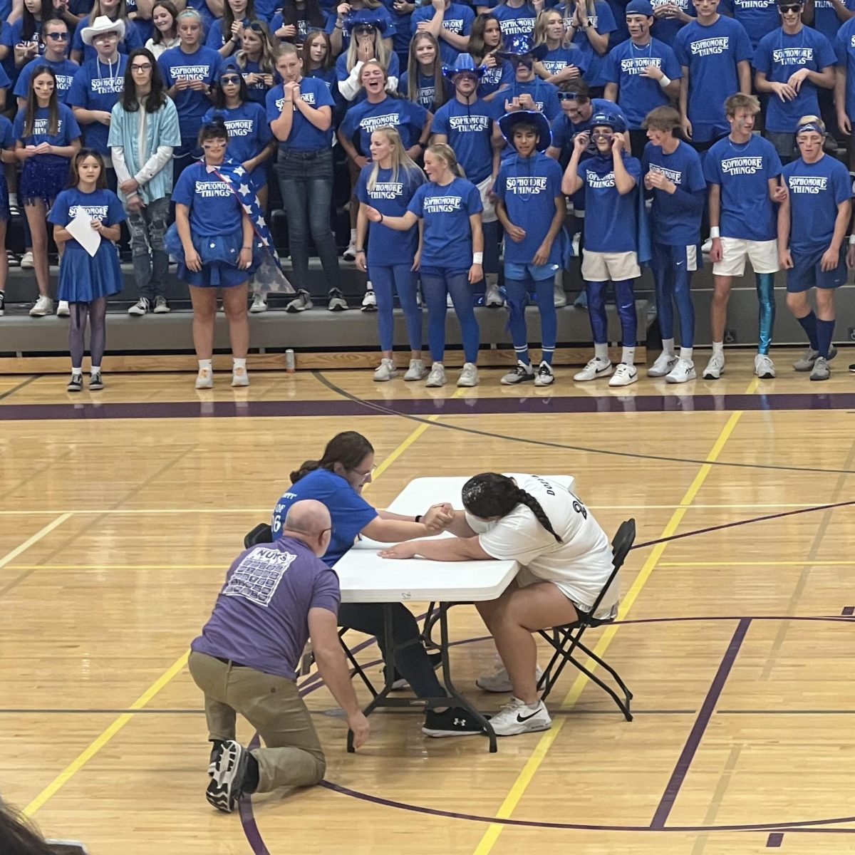 Juniors vs. the seniors girls arm wrestling lasted a long time; and people were on edge watching, seeing who would win. In the end the juniors won after that long match.