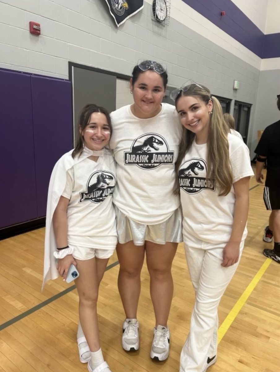 (From left) Tia Adame, Jocelyn Pettersen  and Ambriel Roberts celebrate Jocelyn's arm-wrestling win in  the battle of the classes! 