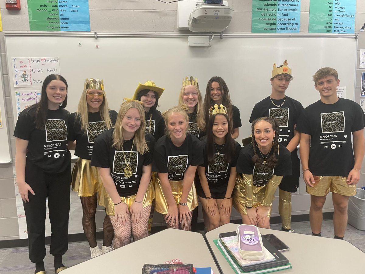 Seniors in Mrs. Gunderson's Spanish IV class pose for a picture clad in black and gold for BOTC on Thursday. (L- R) Mackenzie Weinkauf, Daviney Dreckman, Elsie Munson, Isabelle Fuhr, Megan Hames, Gavin Schaefer, Bryer Hoffmann, Sophia Cooke, Hannah Davey, Leanna Brown, and Sarah Todesco.