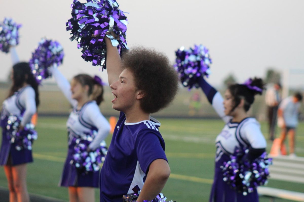 Sophomore Tylee Haefner-Richardson in the  spotlight here as the cheerleaders pep everyone up! 