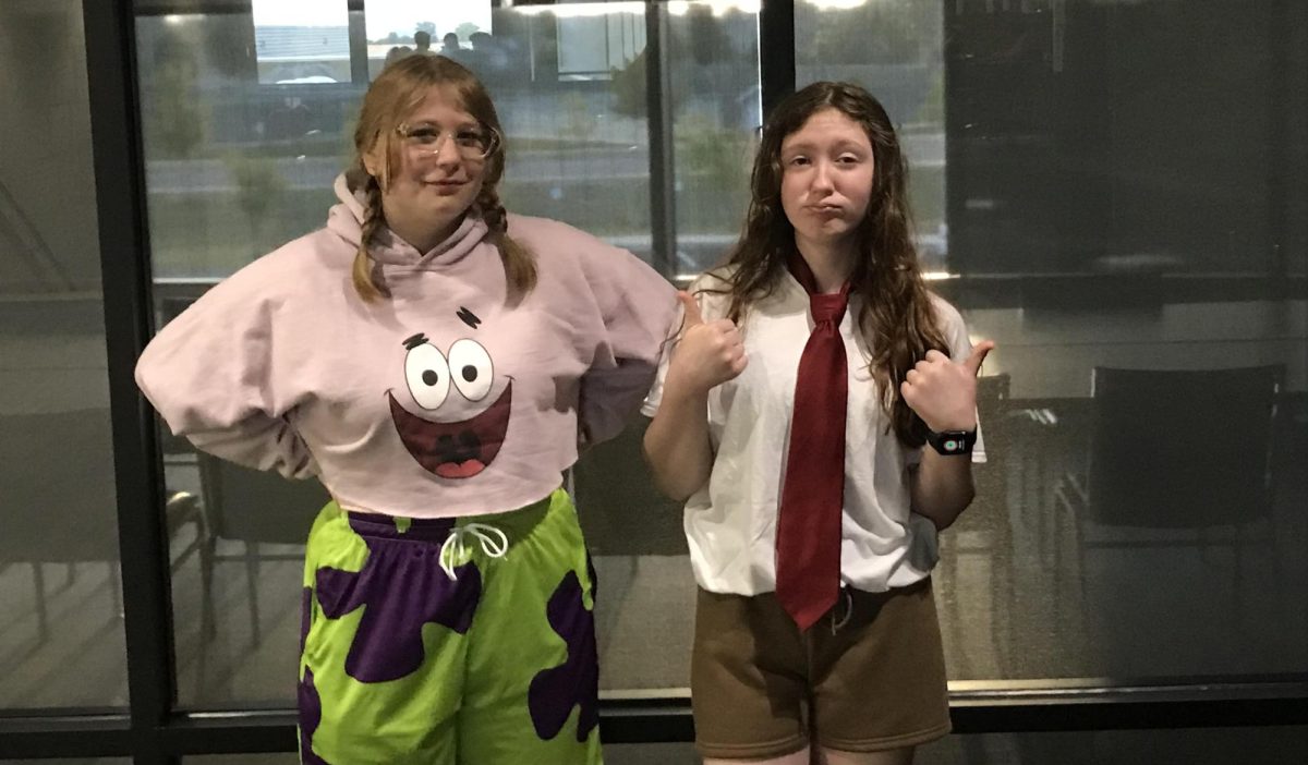  "Patrick Star" (Zoey Delong)  and "Spongebob SquarePants"  (Celsie Benson) pause their day for a picture. 