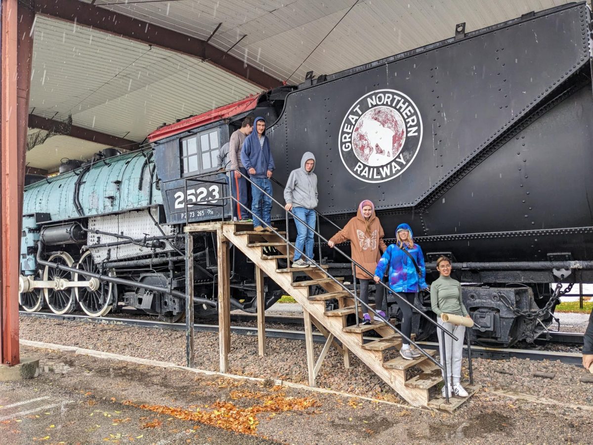 Students of Mrs. Lewandowski on a historical train site despite just visiting a nearby College.