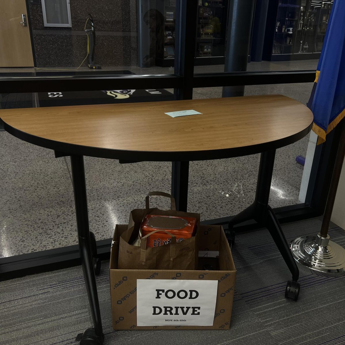 One of the food donation box's sat in the office filled more than half way.