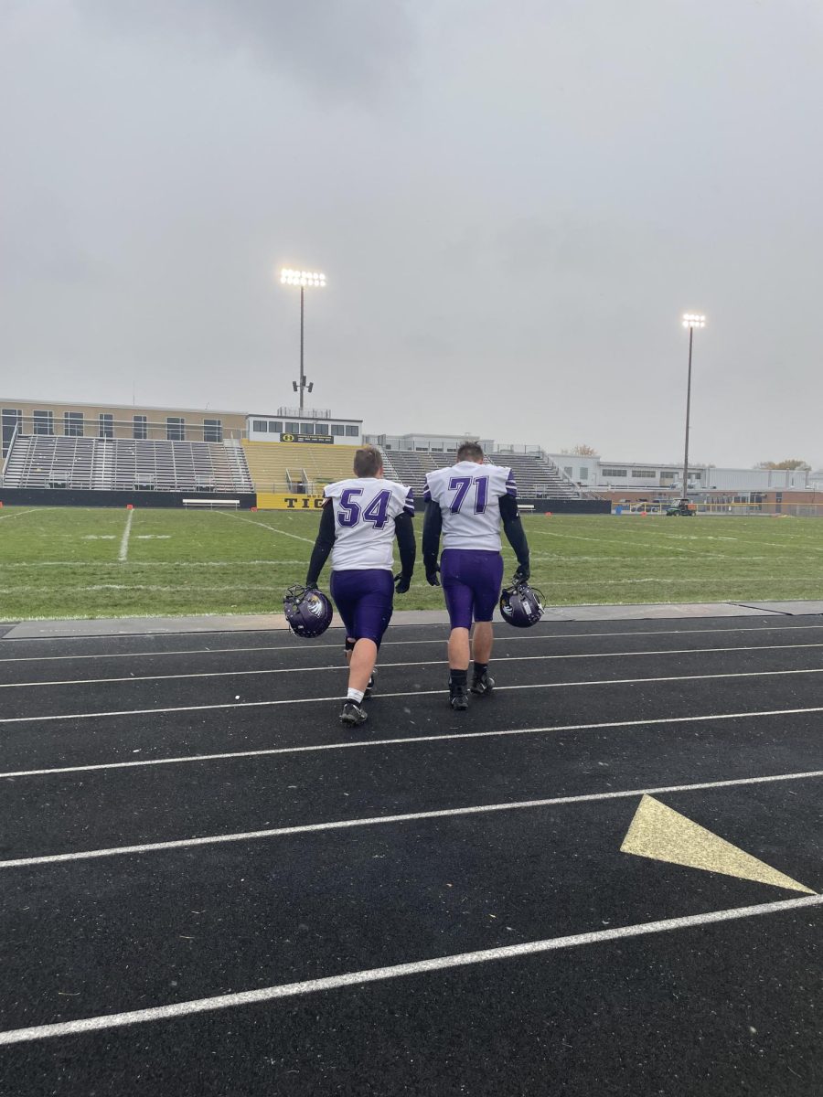 Senior players Brody Griebel (left) and John Haler walk off the football field. (Photo by Jaden Jay)