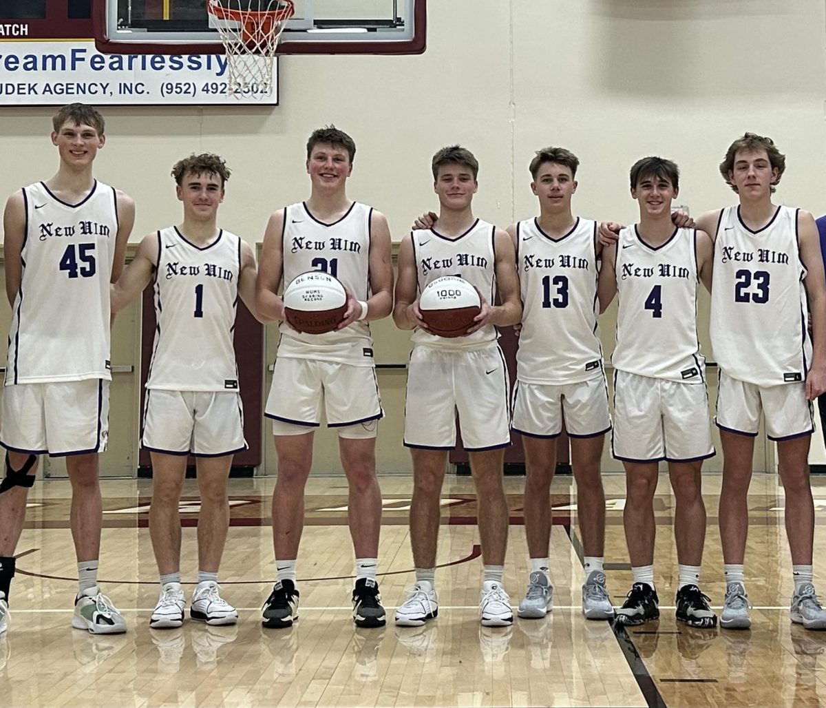 Senior's(left to right) Nate Firle, Ayden Jensen, Colton Benson, James Osborne, Will Fossen, Easton Clark and Gavin Epper pose for a picture after a game.