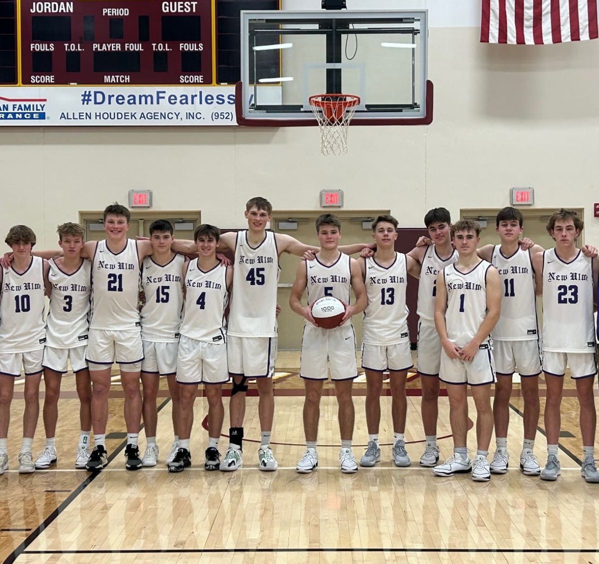 New Ulm boys basketball team poses for a picture after the game.