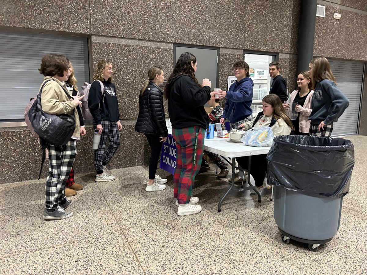 Free hot chocolate being made by student council for students on "the night before holiday break"