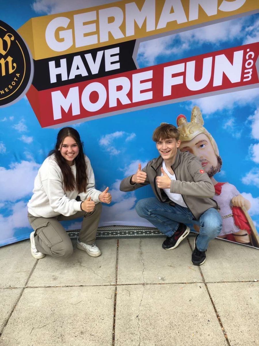 Jule (left) Jakob (right) are posing infront of a picture in New Ulm 