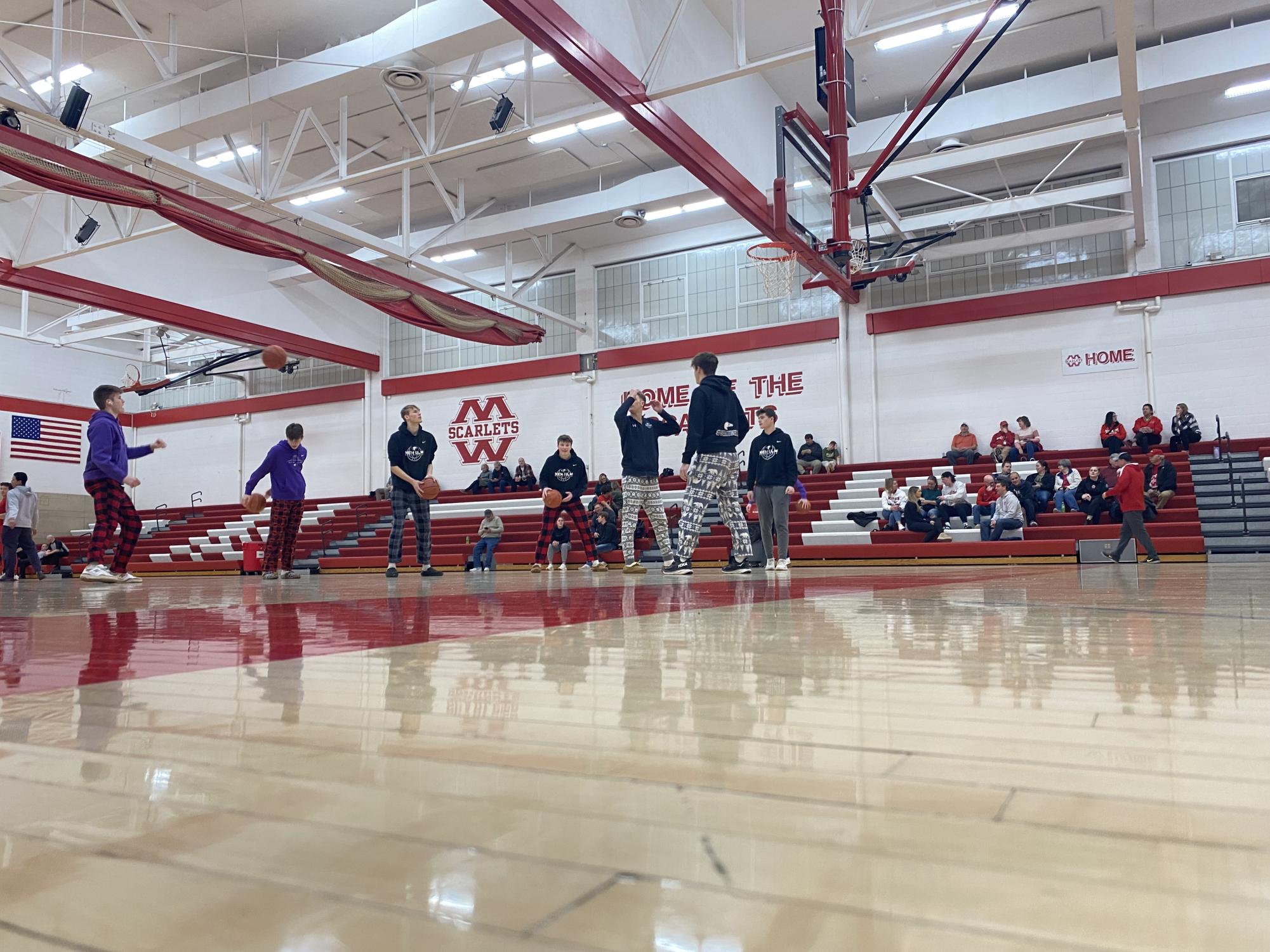 Eagle cagers getting a feel for the Mankato West Scarlet's court during halftime of the JV game.