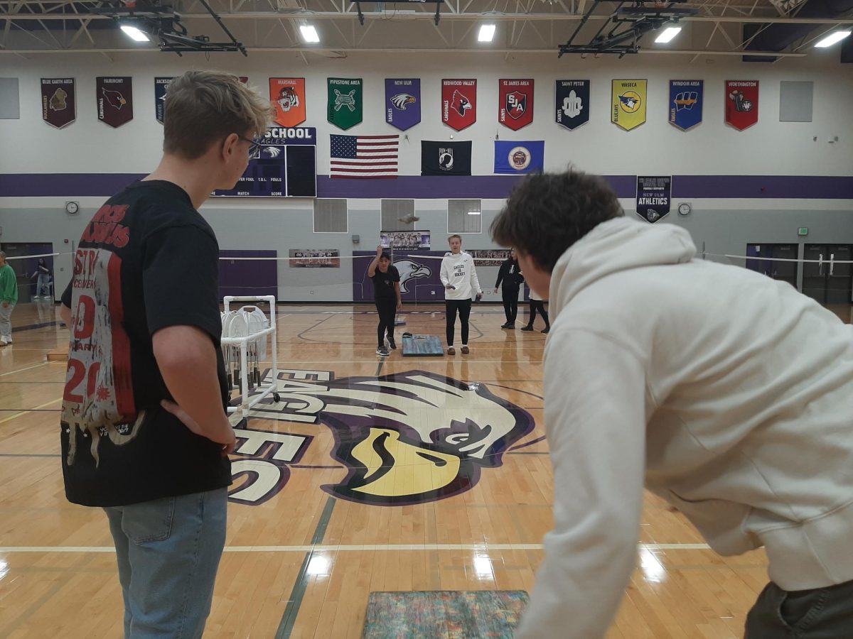 Angel Sanabria takes a shot while his opponent Gavin Schaefer watches intently. 