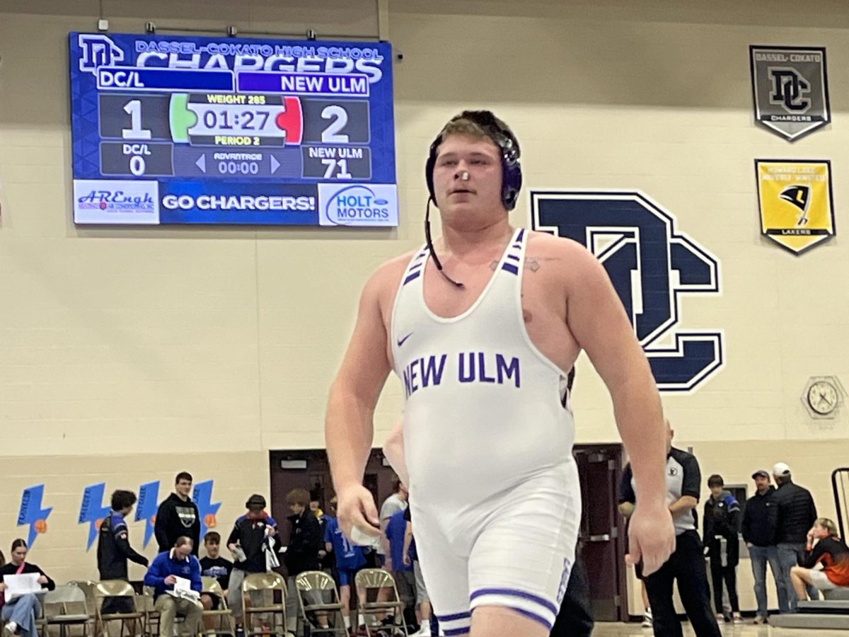 Evan Thompson after winning the final match of the dual with a fall, leaving the score board 71-0. 