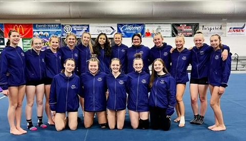 NUHS gymnasts pose for a photo before their big meet Saturday at Marshall.