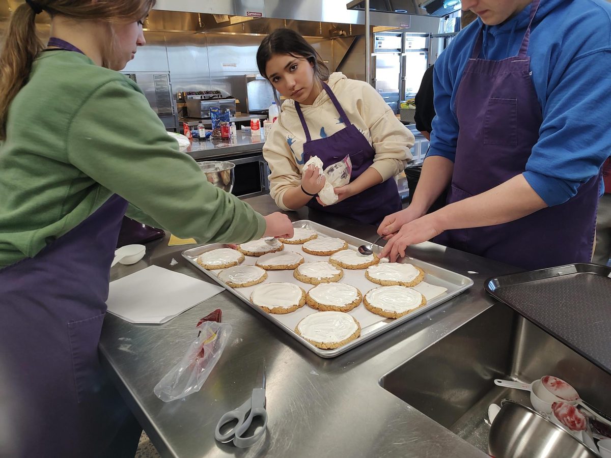 Cookies being decorated and finalized