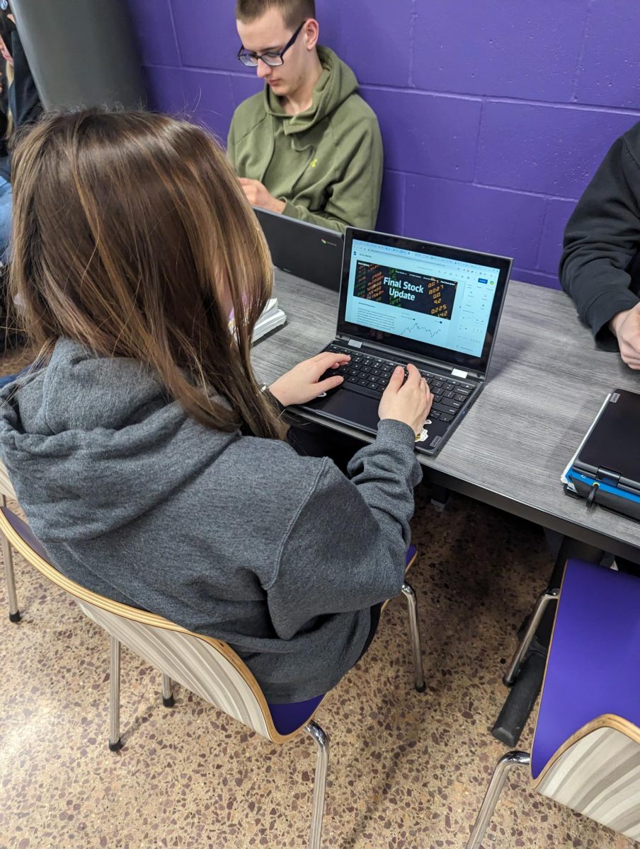 Senior Miranda Deters works on her final economics project.