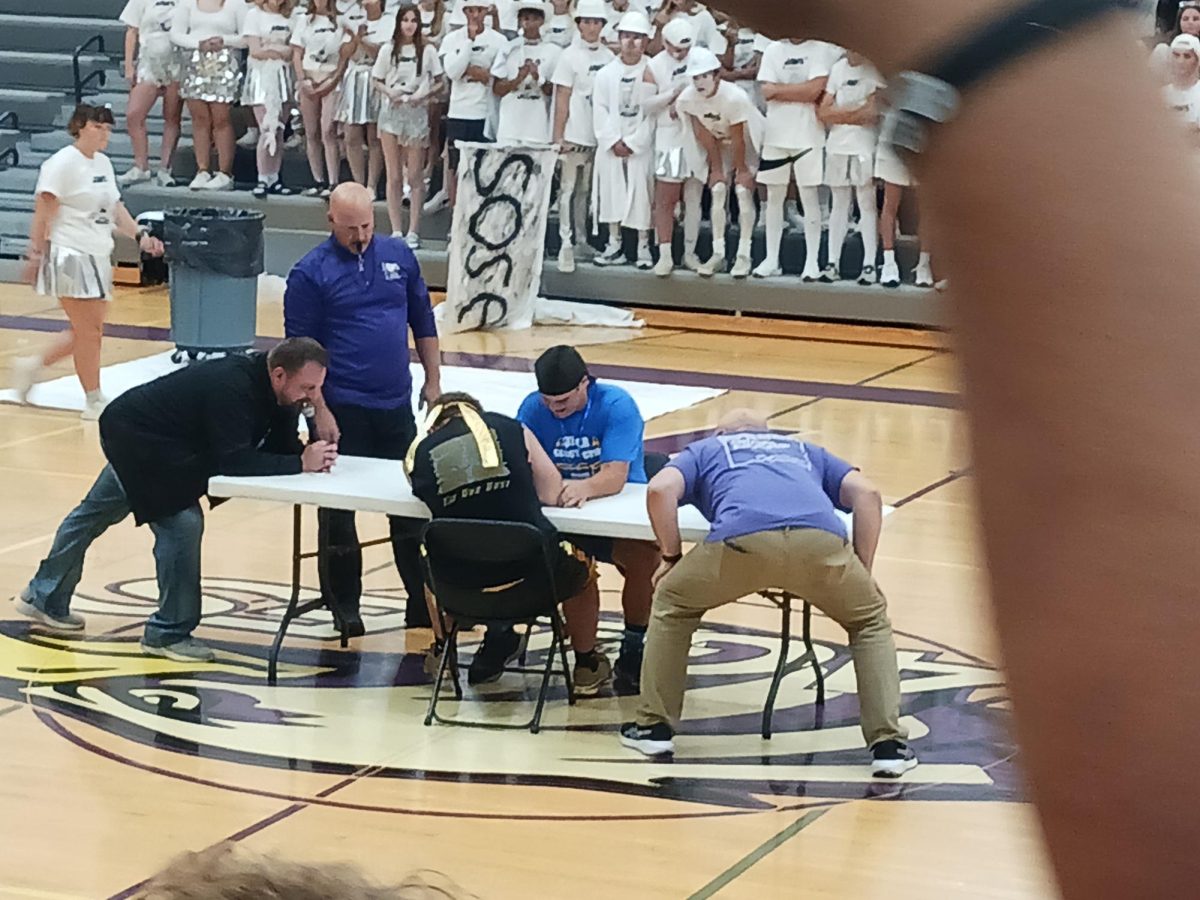 Senior Henry Waloch takes down Sophomore Tanner Backer in an electrifying finish to the arm wrestling event of BOTC 2024.