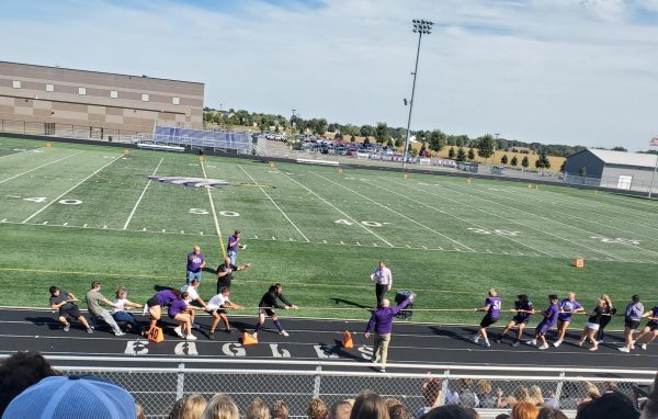 The seniors take the freshman down in tug of war following a homecoming pepfest.