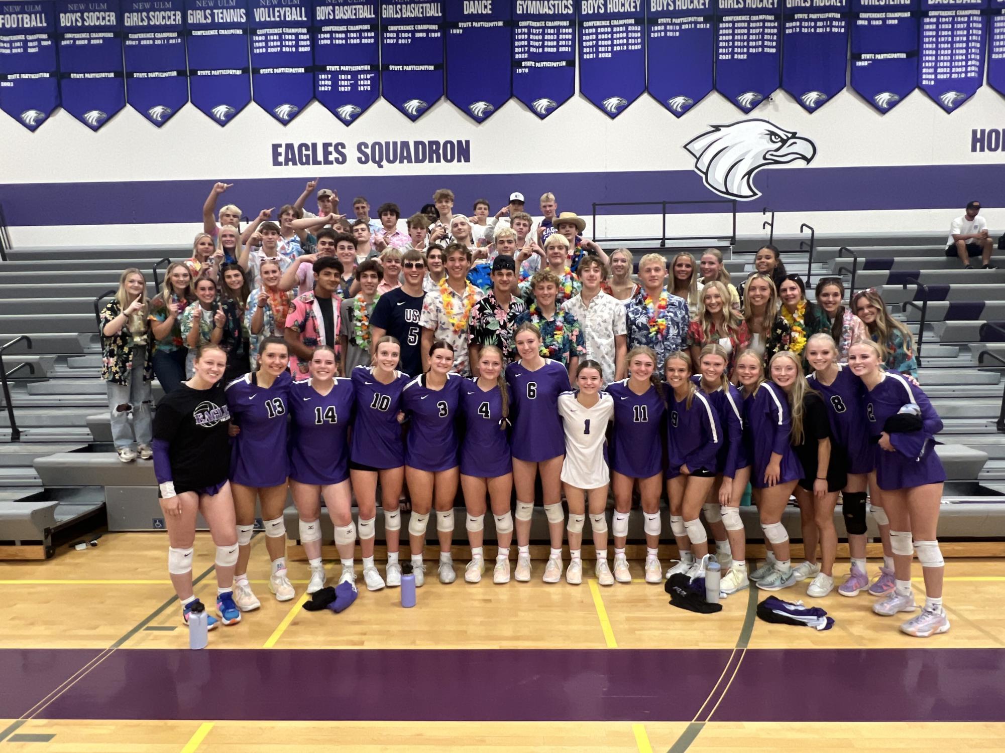 Girls Varsity Volleyball with the Eagle's squadron after a joyful victory.