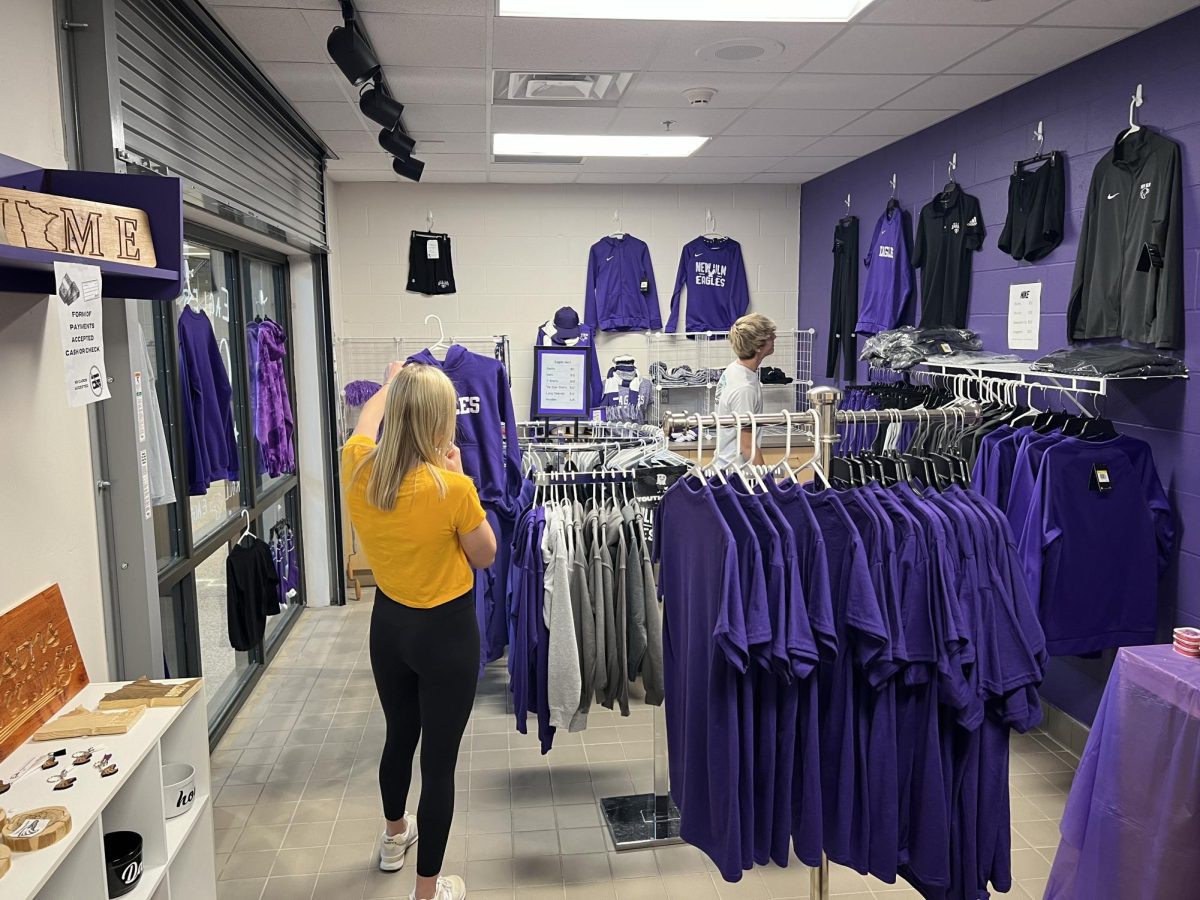 Juniors Brooklyn Lewis and Kyle Albrecht checking out the merch.