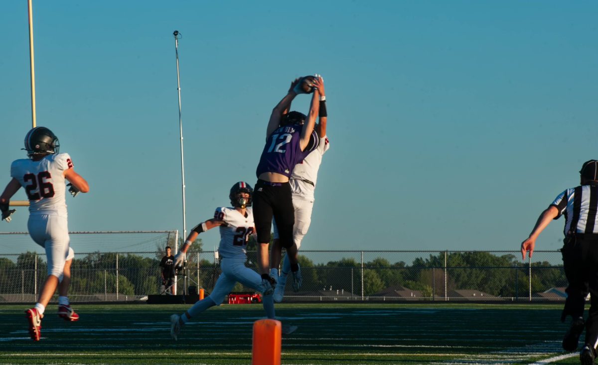 Zach Hubbard catching the ball over Worthington  defense