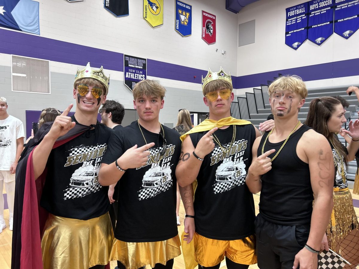 Seniors (left to right) Dain Barie, Brody Hacker, Sam Ibberson, and Issac Friese pose after a BOTC win.