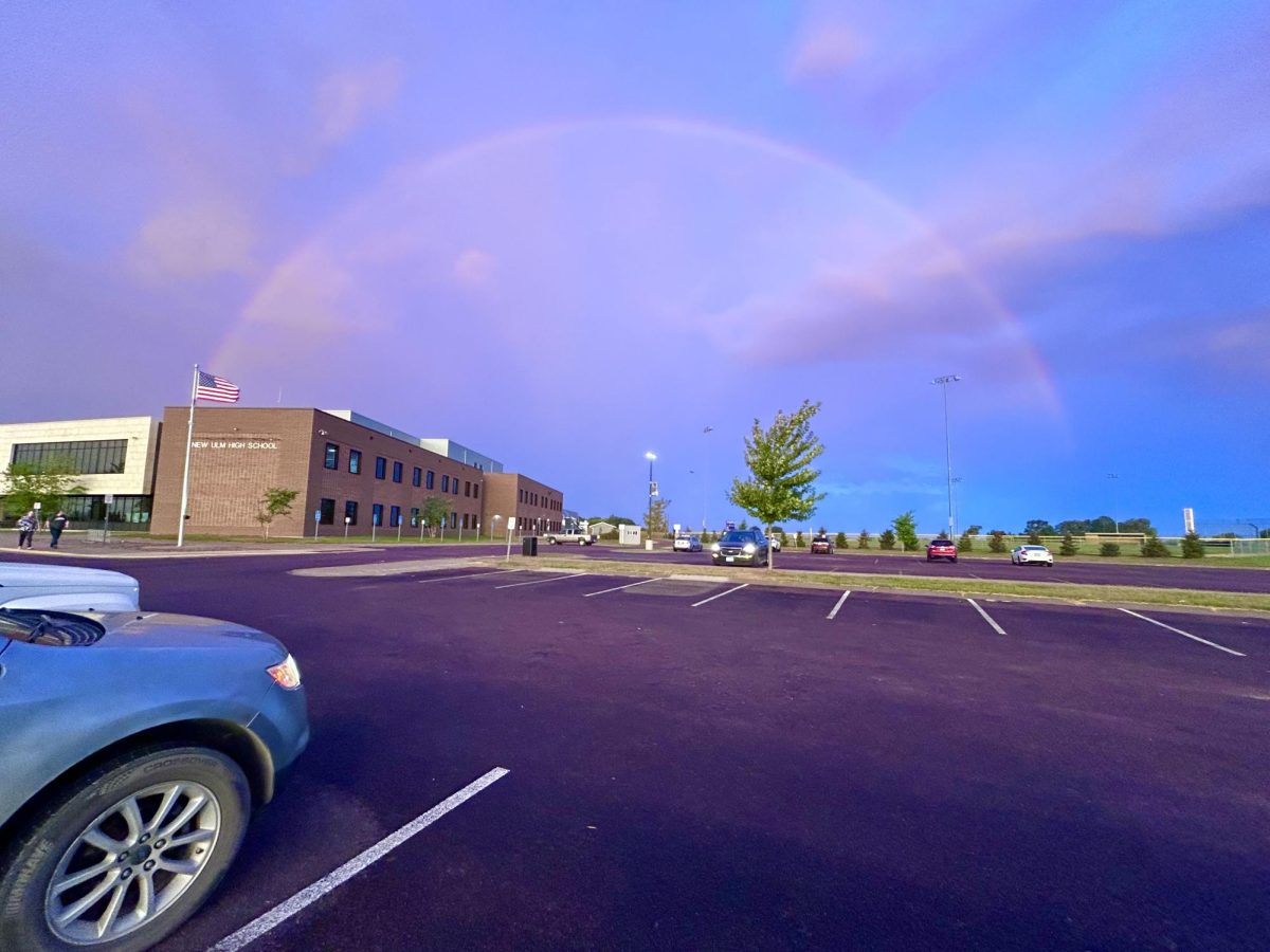 A rainbow shines over New Ulm High School early morning.