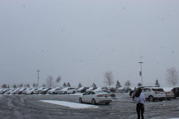 Students going to the parking lot in the middle of the snow storm.