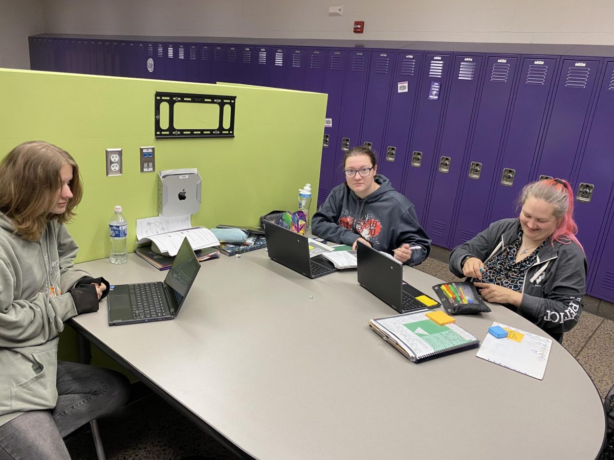 Working on Investigating Physics!
Left to Right: Hannah Norway, Winter Eastman, and a para