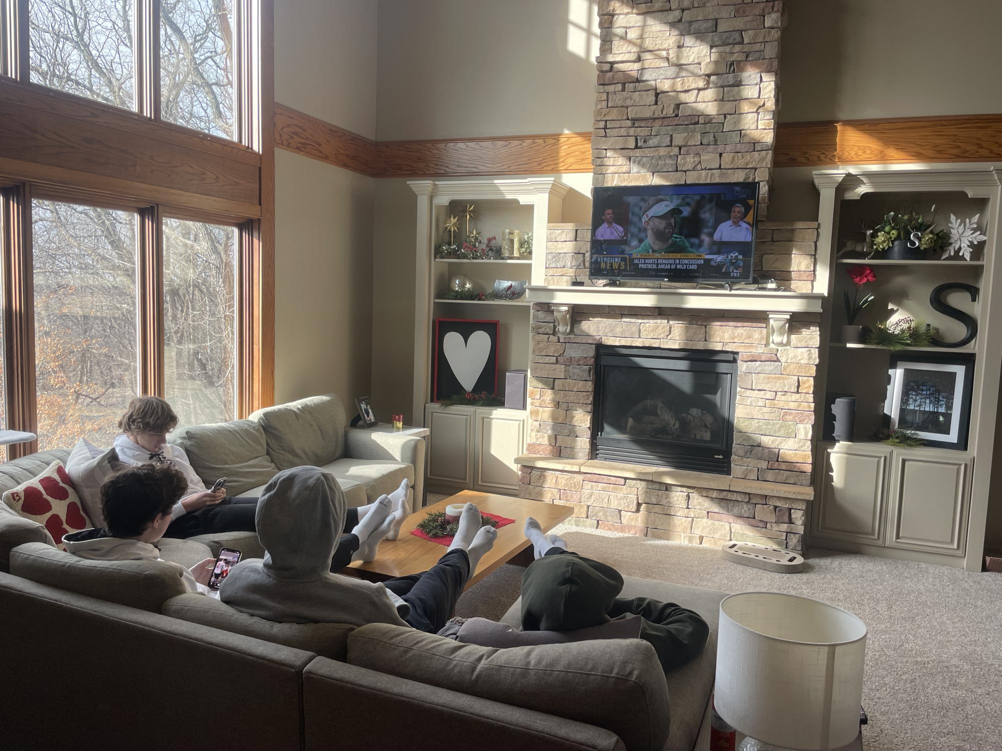 Senior friends (L to R) Jack Greibel, Jaxon Buegler, Nick Risen, and Eli Gieseke relax after a full meal, watching "The Herd"