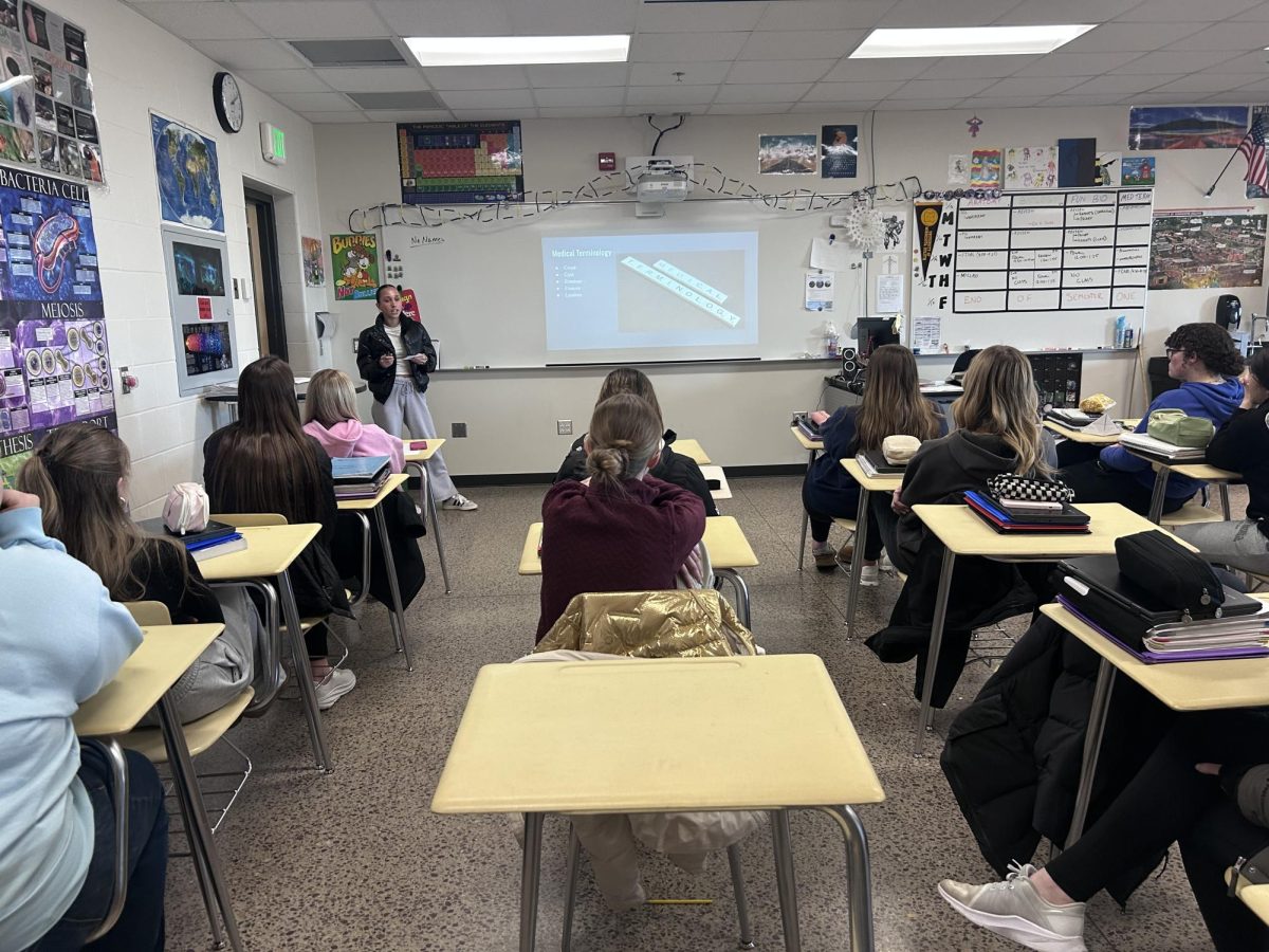 Senior Berkley Wilfahrt gives a presentation on dermatology in the class Medical Terminology and Careers.