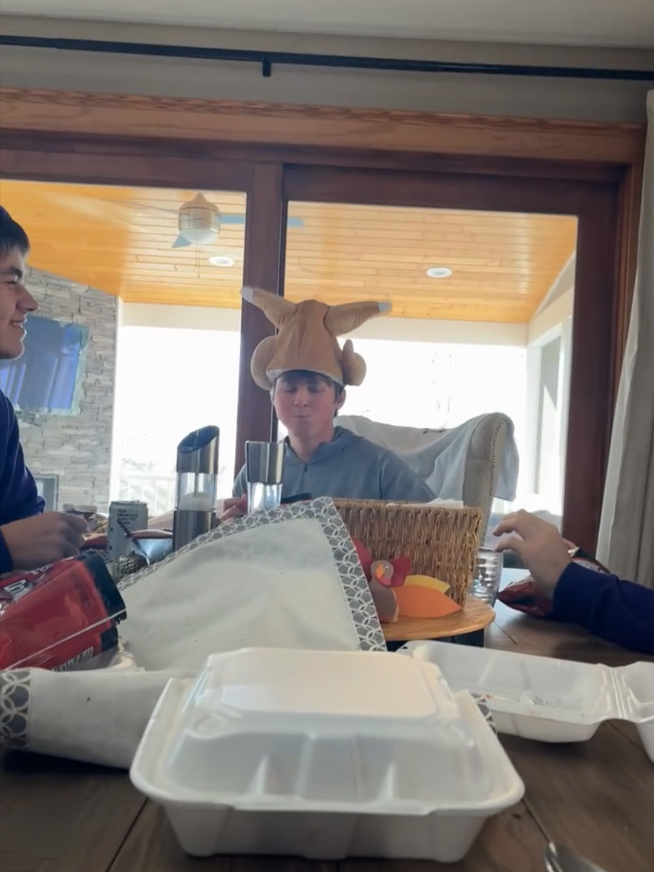 Senior Cullen Slette eats lunch in a turkey hat on the week of Turkey Bingo. 