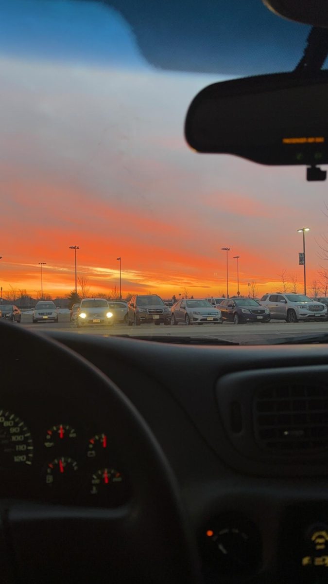 The day begins with the last sunrise at New Ulm High School for semester one. The parking lot fills for students to take their finals. 