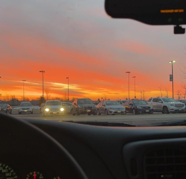 The day begins with the last sunrise at New Ulm High School for semester one. The parking lot fills for students to take their finals. 