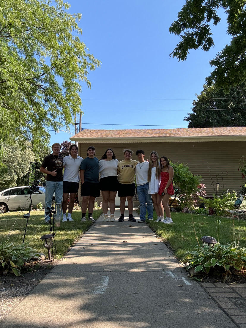 Senior friends (L to R) Bodee Schmiesing, Jaxon Salonek, Brandon Sieg, Jocelyn Pettersen, Henry Waloch, Sam Chalakov, Ambriel Roberts, and Tia Adame gather outside of grandma Kathy's house earlier this year