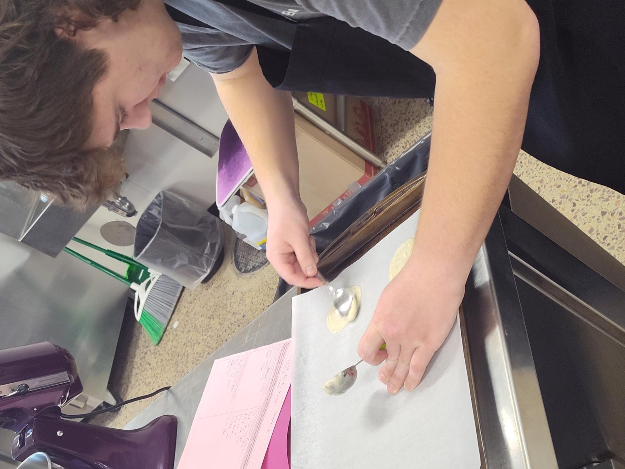 Senior Brandon Sieg portioning out fortune cookies for international foods first lab
