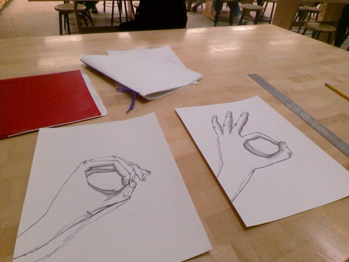 In Mr. Santiago's 5th-hour Drawing and Painting class, students are learning about 2-point perspective.