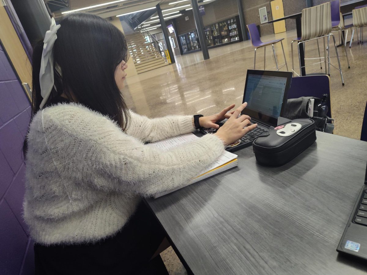 Senior Lilith Aubart studying for a college Psychology retake. 