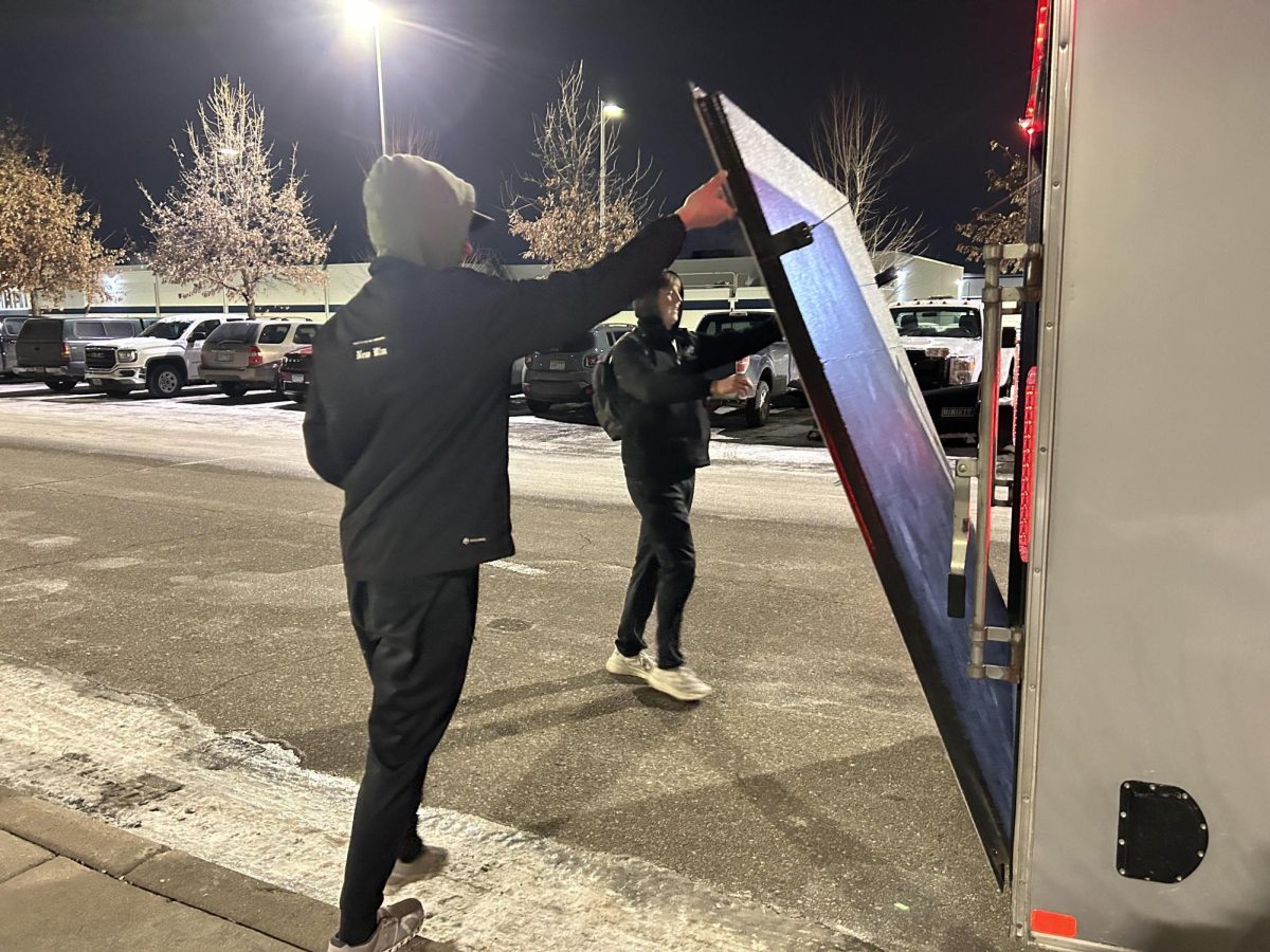 Tucker Berg (left) and Cullen Slette closing the boys hockey trailer