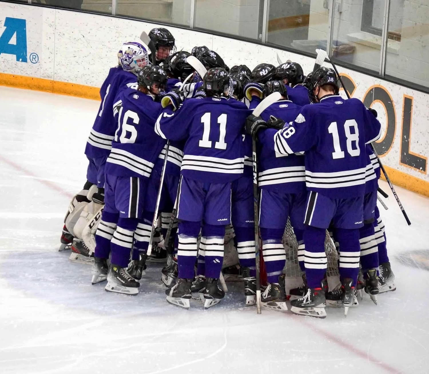 New Ulm boys hockey team getting pumped up before Section Semi-final game at Gustavus vs. Mankato West