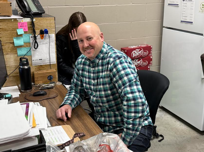 Mr. Nelson working in his office.