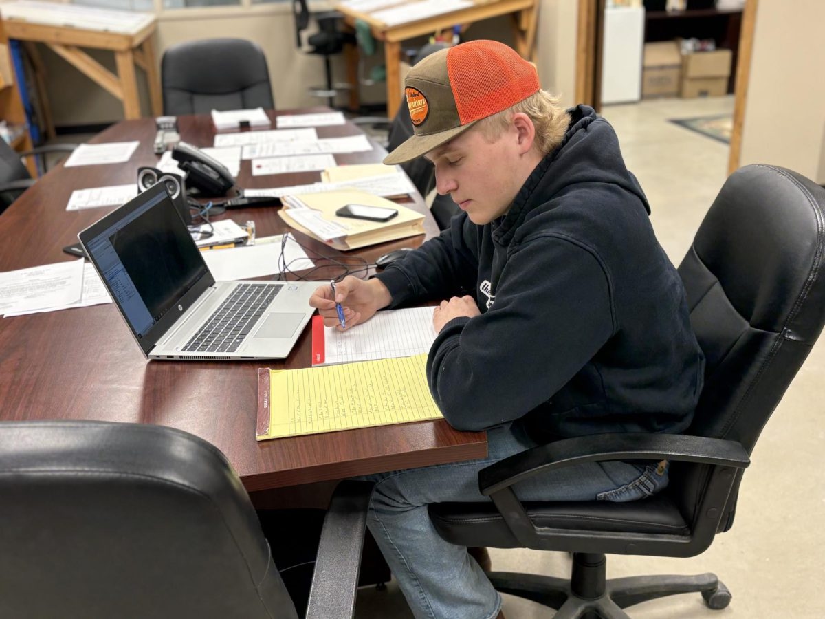 Senior Ben Alfred hard at work learning the ways down at M.R. Paving & Excavating.