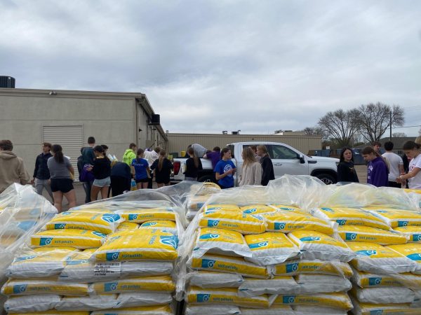 New Ulm track athletes help with the salt delivery to the costumers